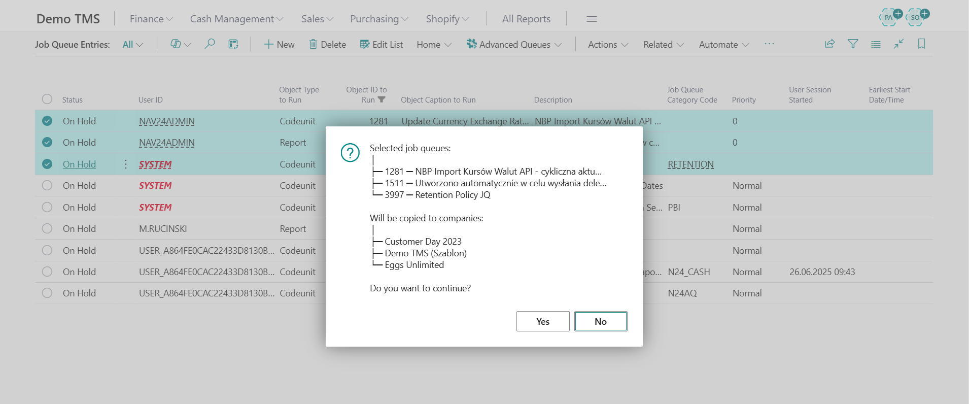 Job Queue Entries list in Business Central with multiple queues selected and a confirmation dialog showing the selected job queues and target companies for copying, asking the user to confirm whether to continue.